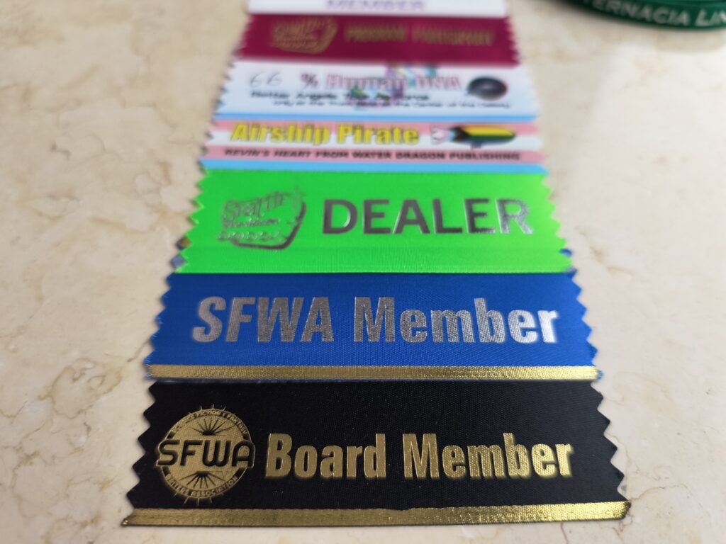 ribbons attached to name badge